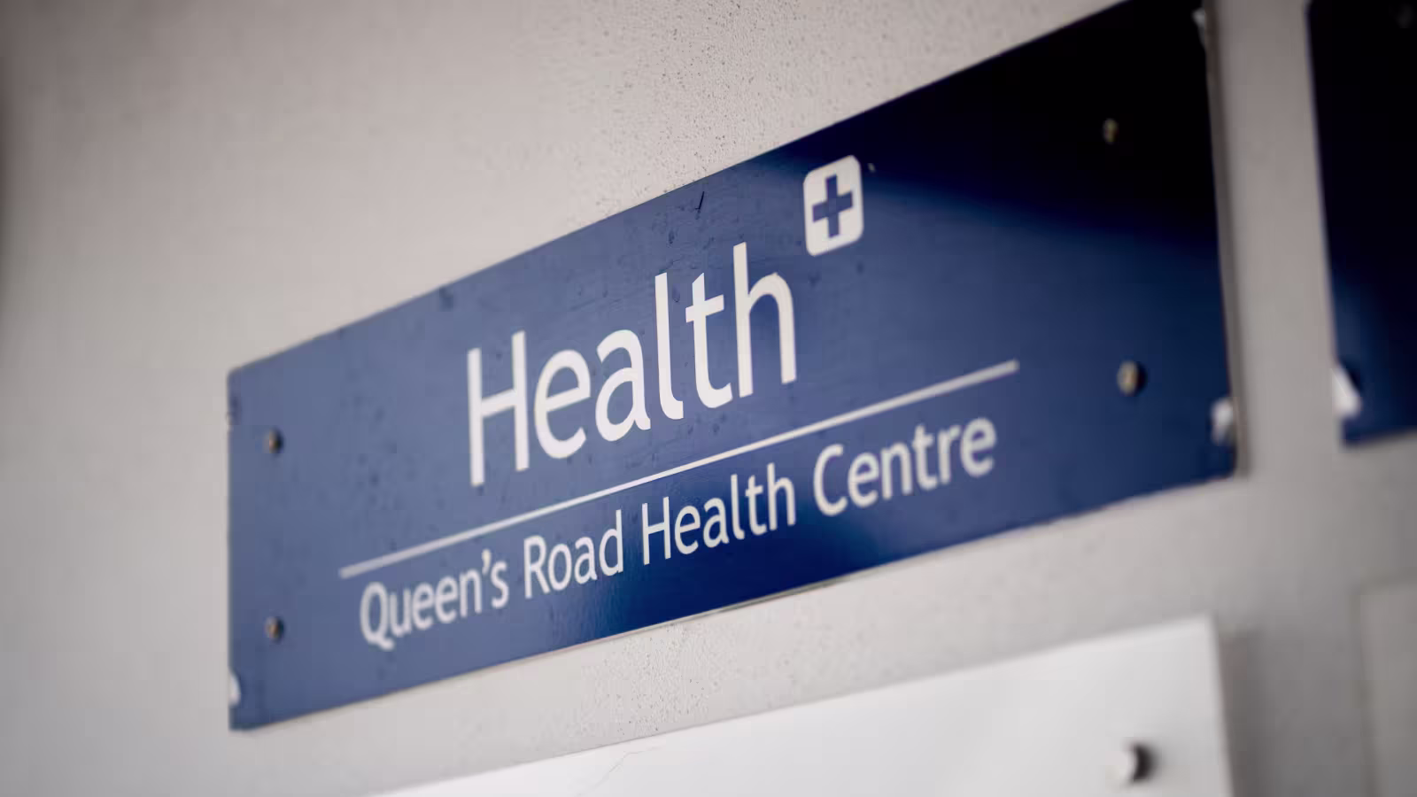 Health Plus, Queen's Road Health Centre sign